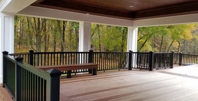 covered patio with wooden deck and black vinyl railings gaithersburg md